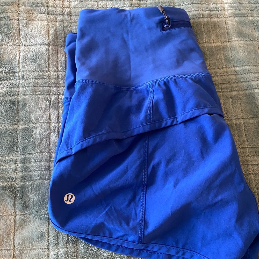 Lululemon high-rise shorts. Blue. Size 8. Back zip pocket.
